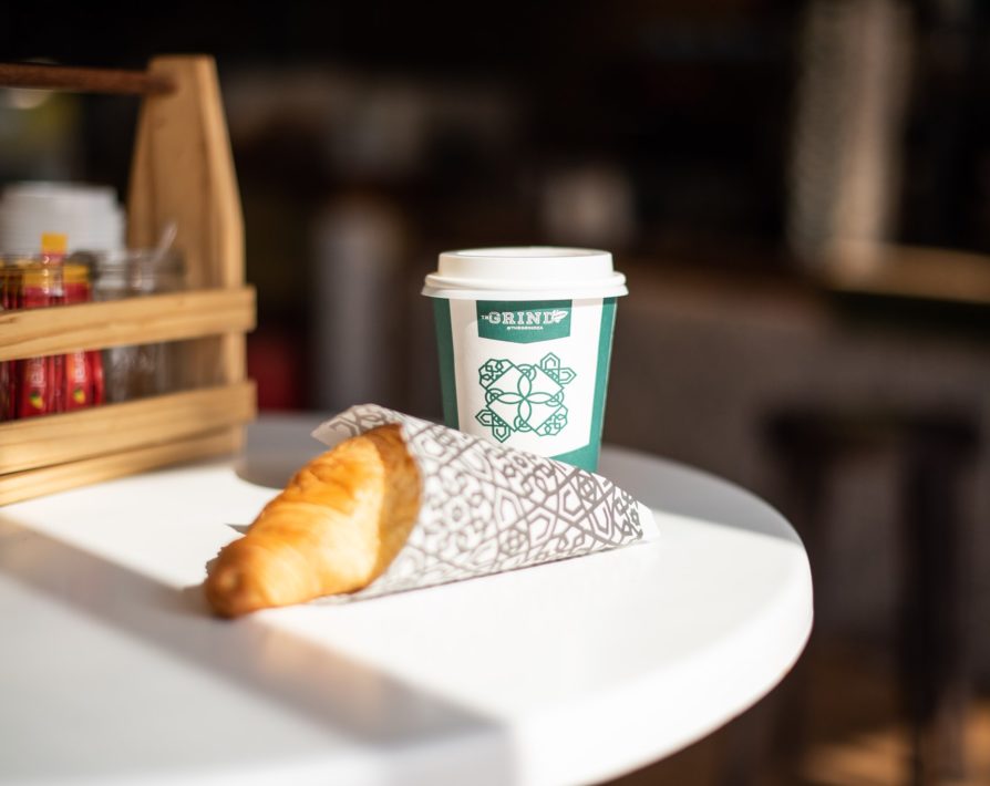 A Grind coffee with a croissant